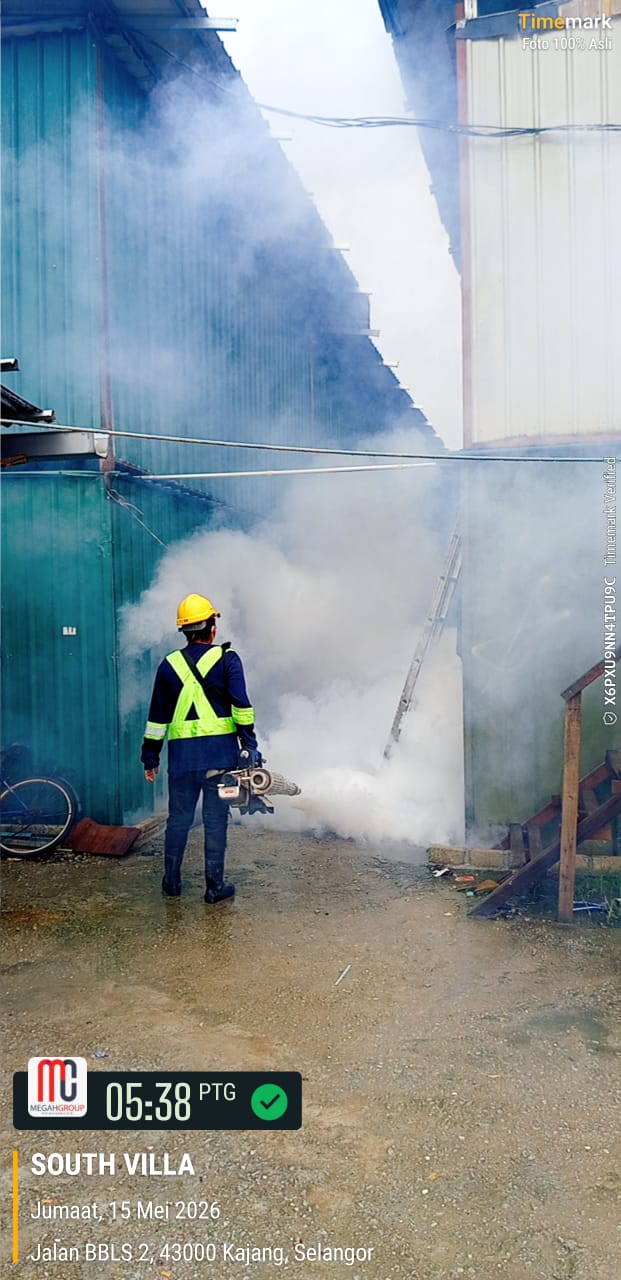 Pest control technician in full PPE — Megah Group Resources